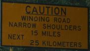 cautionwindingroadnarrowshouldersnext15miles25kilometers.jpg